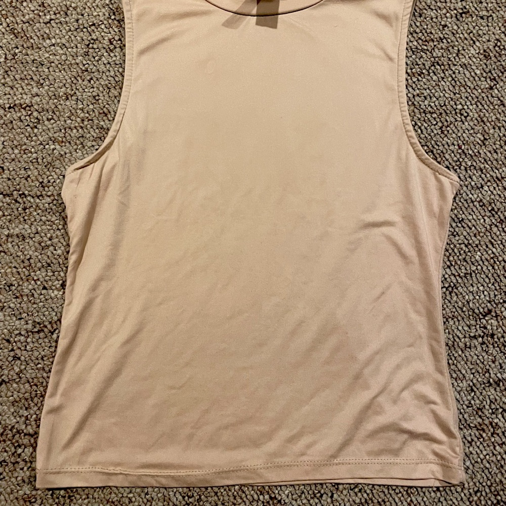 Tan tight tank top. slightly cropped. small stain